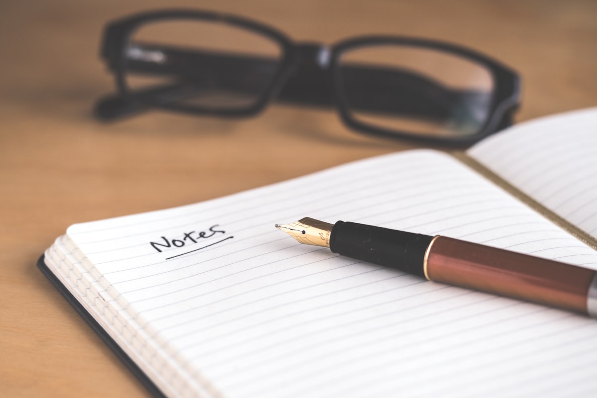 Notebook with email structure sketched out